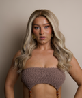 Woman wearing a textured brown bikini against a neutral background