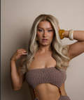 Woman wearing a textured brown bikini against a neutral background
